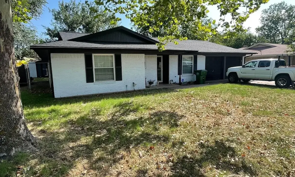 Professional roofing crew working on a residential roof in Flower Mound